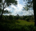 Вид на монастырь из близлежащего леса. Июль 2008 года